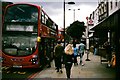 TQ3183 : View of passengers boarding a bus on Upper Street by Robert Lamb