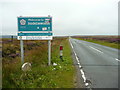 SE0506 : Boundary sign and stone on the A635 by Humphrey Bolton