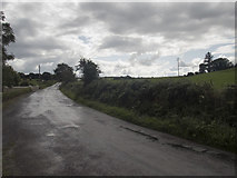 W3852 : Road through rising ground by Neville Goodman