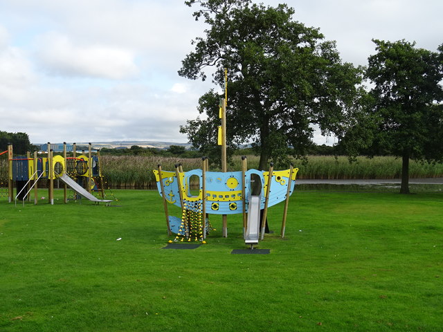 Play area beside the reedy pool