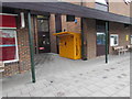 Yellow Amazon Locker outside Didcot Parkway railway station