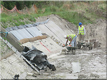 SP9012 : Work on the side of the Wendover Arm of the Grand Union Canal by Chris Reynolds