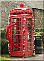 A yarn bombed telephone box at Ettrickbridge