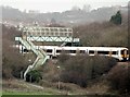 Footbridge over railway and train  north of West St Leonards station