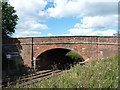 SJ4803 : Railway bridge on Station Road by Richard Law