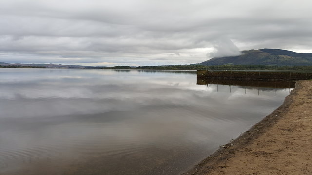 Loch Leven with the walls that channel the water to the Sluice House