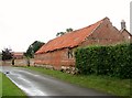 TG1114 : Old brick barn at Green Farm by Evelyn Simak