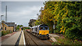 Empty freight train waiting at Tain