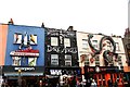 View of the shop fronts of Scorpion Shoes, Dark Angel and Max Orient from Camden High Street