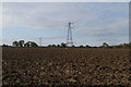 Pylons in the ploughed field