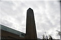 Looking up at the Tate Modern chimney from the South Bank