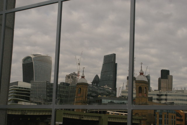 View of a reflection of the Walkie Talkie, Cannon Street station, Gherkin and the Cheese Grater in the Financial Times building