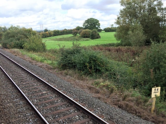 View from a Didcot-Worcester train - Fields, scrub and trees near Kingham