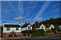 Aircraft trails above houses in Chertsey Road