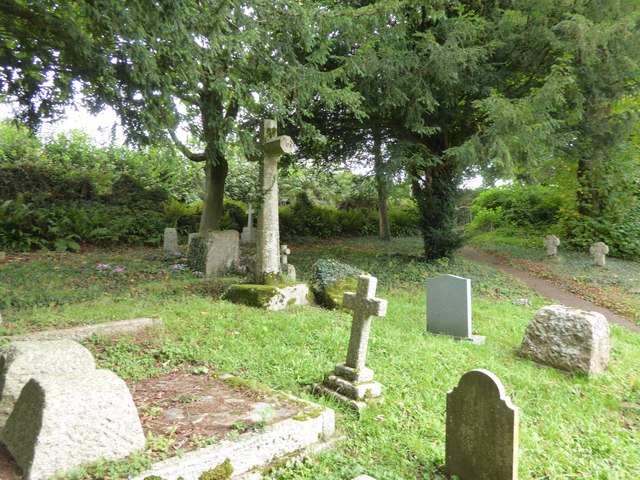 Gravestones and the churchyard cross, Cadbury