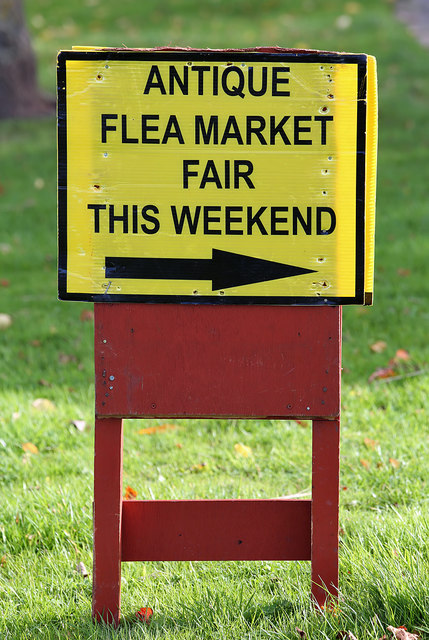 A sign for an antique fair at Kelso