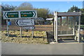 Road sign and bus stop, Landrake