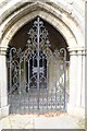 TF0246 : St Peter's church: Iron gates to the Porch by Bob Harvey