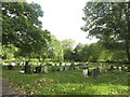 NZ3364 : Graves in Jarrow Cemetery by Graham Robson