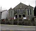 Apocalyptic Oz banner on the railings of a former chapel, Tonypandy