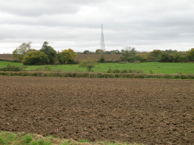 Ploughed field with radio mast