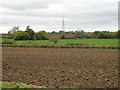 Ploughed field with radio mast