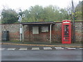 Telephone box and bus shelter on Church Street, North Creake