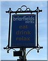 TF7543 : Sign for the Briarfields Hotel, Titchwell  by JThomas