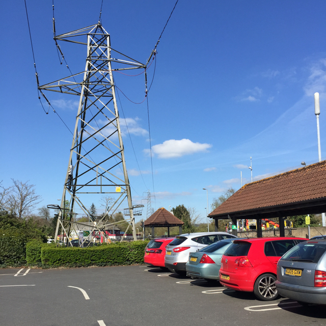 Power lines over a supermarket car park, Newton Abbot