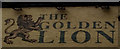 Painted sign on the Golden Lion public house, Whitby