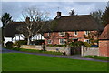 Thatched cottages by the green at Urchfont