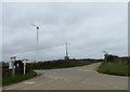 Road junction and wind turbine near Trevidgeowe Farm