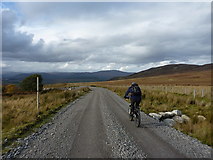 NH5315 : Riding out down the Corriegarth access track by Richard Law