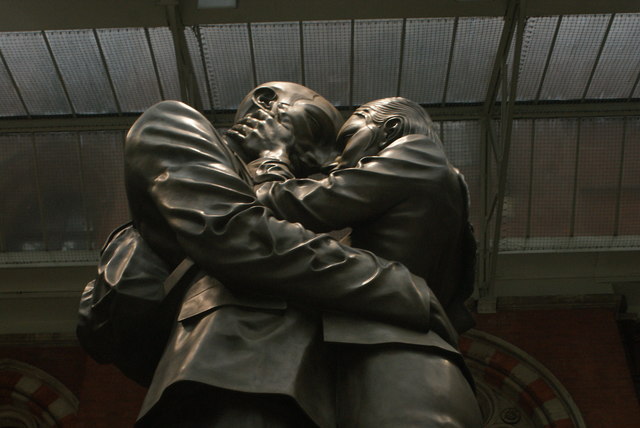 Looking up at the "Lovers" statue in St. Pancras station