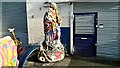 TQ3889 : View of a painted statue of a lady carrying a lamb outside God's Own Junkyard by Robert Lamb