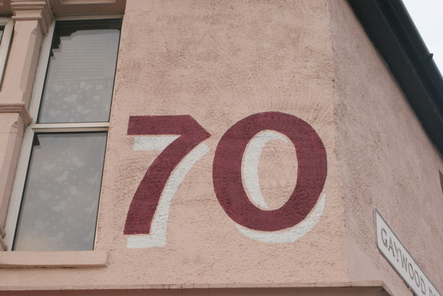 View of "70" painted above Menagerie Makes on Hoe Street