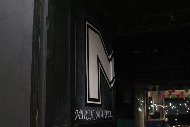 View of "Mirth, Marvel and Maud" street art on the doors of an alleyway beneath the Mirth, Marvel and Maud bar on Hoe Street