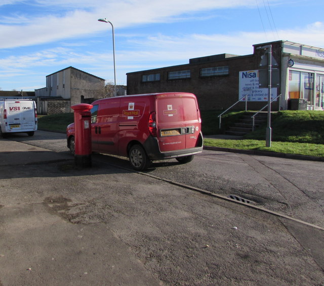 Queen Elizabeth II pillarbox and a Royal Mail van on a Bettws corner