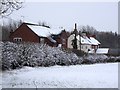 SK2730 : Broomhill Cottages in the snow by Ian Calderwood