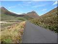J3024 : The Ben Crom Reservoir service road approaching the head of the Silent Valley Reservoir by Eric Jones