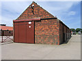 Barn in concrete yard