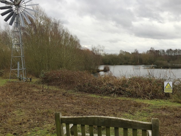 View of a pool with wind-pump, Brandon Marsh Nature Reserve, near Coventry