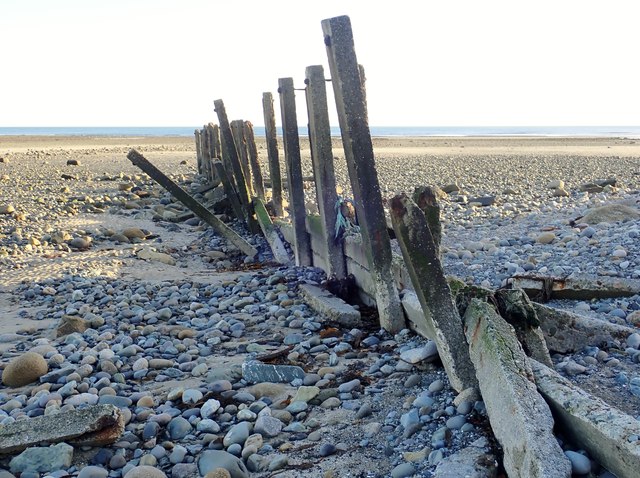 Wave damaged groyne at the mouth of the Shimna River
