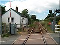 View west along the railway line from the crossing at the centre of Criccieth