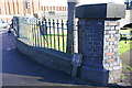 SK5445 : Wall with railings at Main Street / Highbury Road junction by Roger Templeman