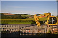 Yellow digger by the A374