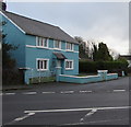 Turquoise house on a Wooden corner