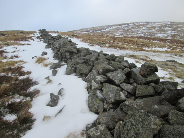 Remains of a dry stone wall on a snowy Stony Cove Pike