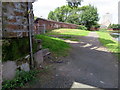 Below the footbridge, and a bench mark