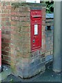 SK4833 : Postbox and bench mark, Tamworth Road by Alan Murray-Rust